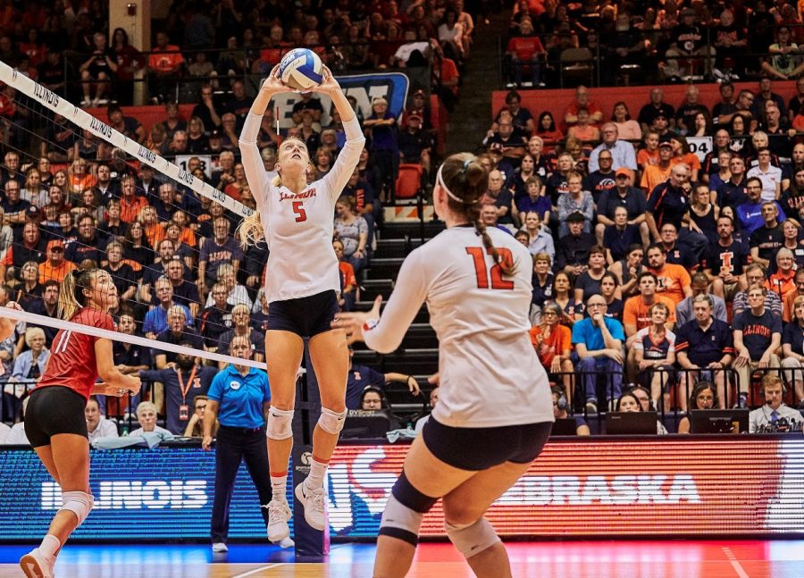 Diana Brown (5) sets the ball to Ashlyn Fleming (12) during the Illini’s game versus Nebraska at Huff Hall on Friday.
