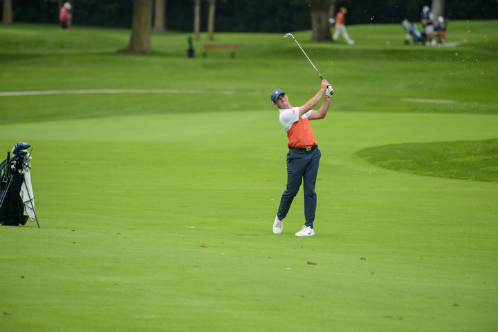 Senior Bryan Baumgarten watches his approach shot at the Fighting Illini Invitational. 
