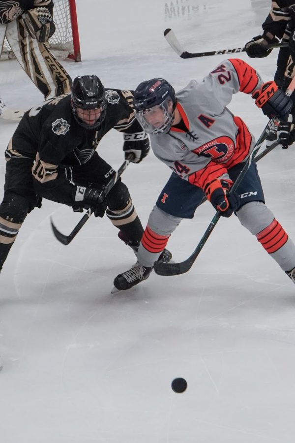 Bobby Ernsting (24) faces off with a Lindenwood defender on Friday at the Ice Arena.