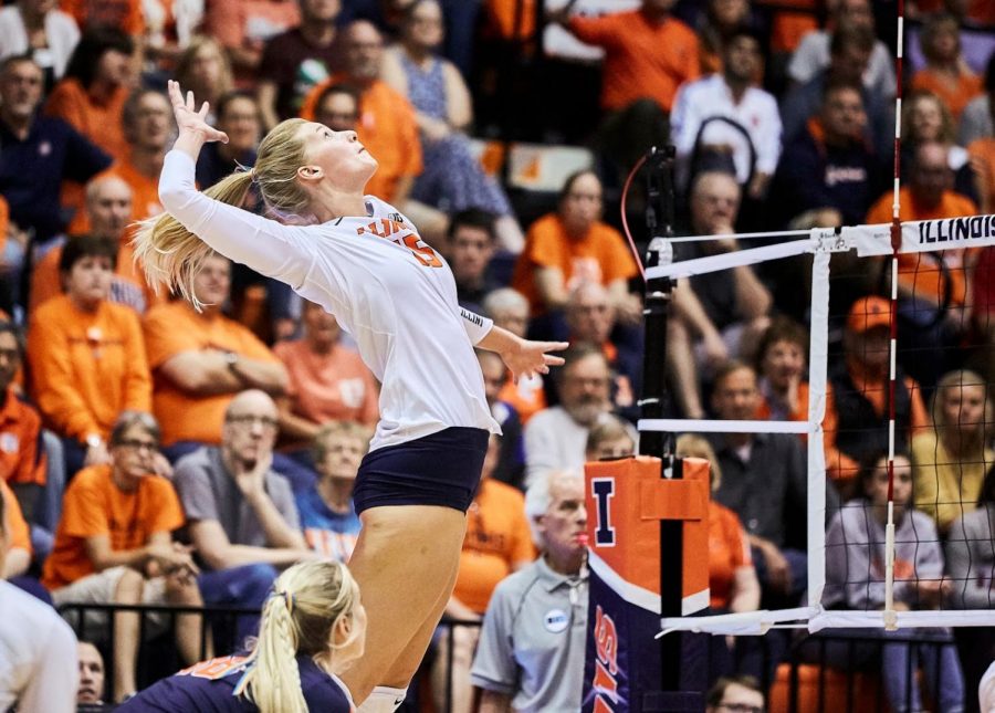 Megan Cooney rises up to spike the ball on Wednesday. The Illini lost 1-3.