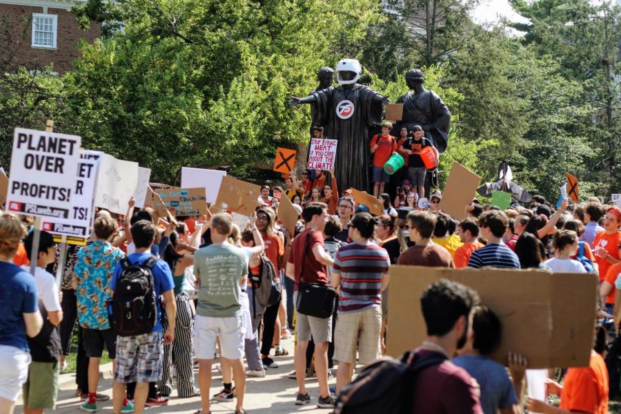 Students congregate while members of the Young Democratic Socialists of America protest during the Earth Strike in front of Alma Mater on Sept. 20. RSOs are working together to encourage students to explore their options before the next election.