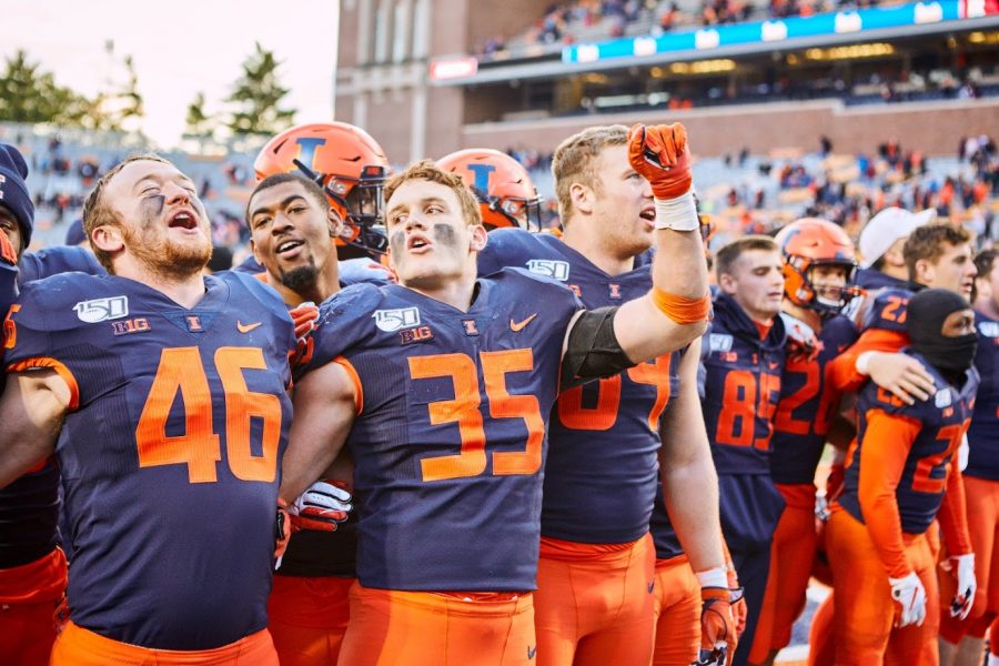 The Illini celebrate their win at Memorial Stadium on Saturday. Illinois beat Rutgers 38-10 after being tied 10-10 at halftime.