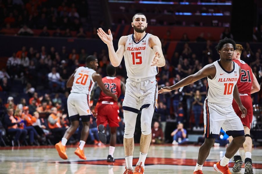 Giorgi Bezhanishvili (15) celebrates after the Illini score at State Farm Center on Friday. Despite a slow start against Lewis in Friday’s exhibition, Illinois pulled through with 83-50 win.