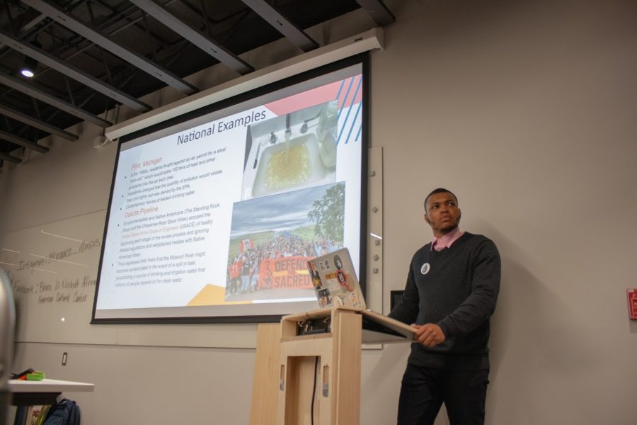 Khiren Johnson , senior in FAA, speaks on his concerns about toxins in the Fifth and Hill neighborhood at the Bruce D. Nesbitt African American Cultural Center on Nov. 21. Of the $3,000 required, RSOs have raised $1,756 to purchase indoor vapor testing kits.