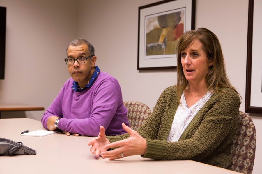 Kristin McMurray (right), associate registrar for Facility Management and Scheduling, talks about how final exams are scheduled with Terry Free (left), class scheduler at the Office of the Registrar.