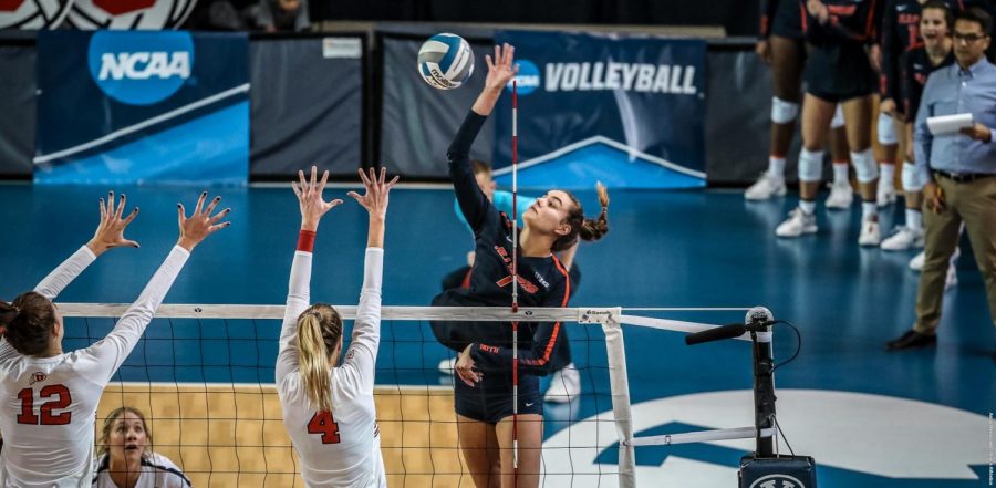 Outside hitter Jacqueline Quade spikes the ball during the Illinois’ game in Utah at Provo, Utah, Friday. The Illini’s loss to the Utes in the first round of the NCAA tournament ended the team’s season.