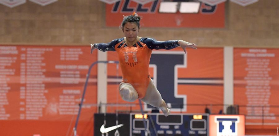 Mia Takekawa performs on the balance beam during the Womens’ Gymnastics Exhibition against Illinois State at Huff Hall on Thursday. While exhibitions do not count toward a team’s record, the event allowed an opportunity for the team to be judged.