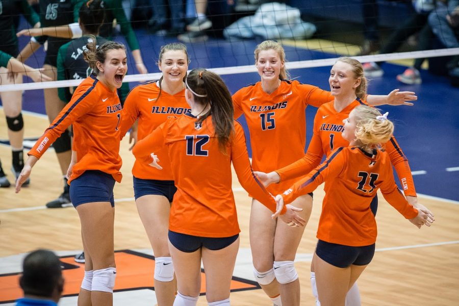 The Illini celebrate after scoring a point during the match against Eastern Michigan in the first round of the NCAA Tournament at Huff Hall on Friday, Nov. 30, 2018. The Illini won 3-0.