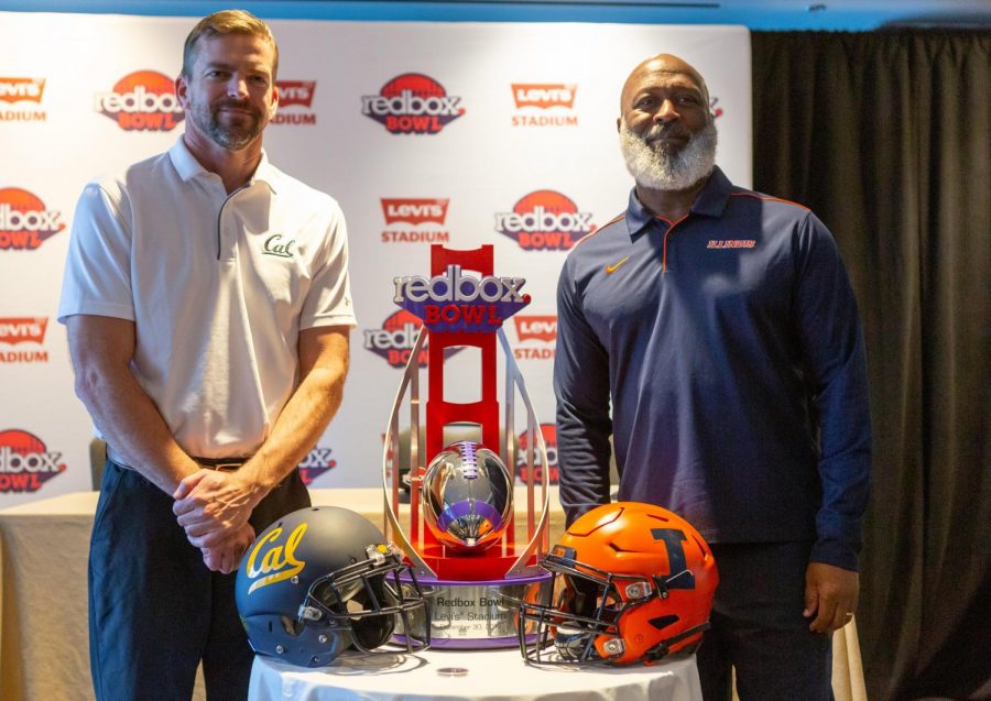 Head+coaches+Justin+Wilcox+and+Lovie+Smith+stand+next+to+the+Redbox+Bowl+trophy+during+a+press+conference+on+Dec.+27+at+the+Hyatt+Regency+in+San+Francisco.+