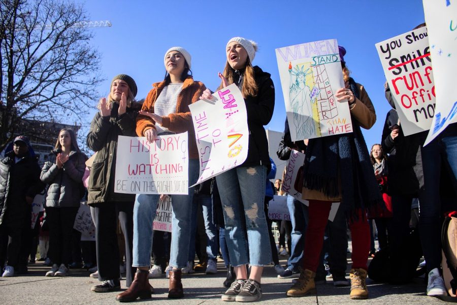 Students gather in front of the Alma Mater for the Womens March on the Main Quad.