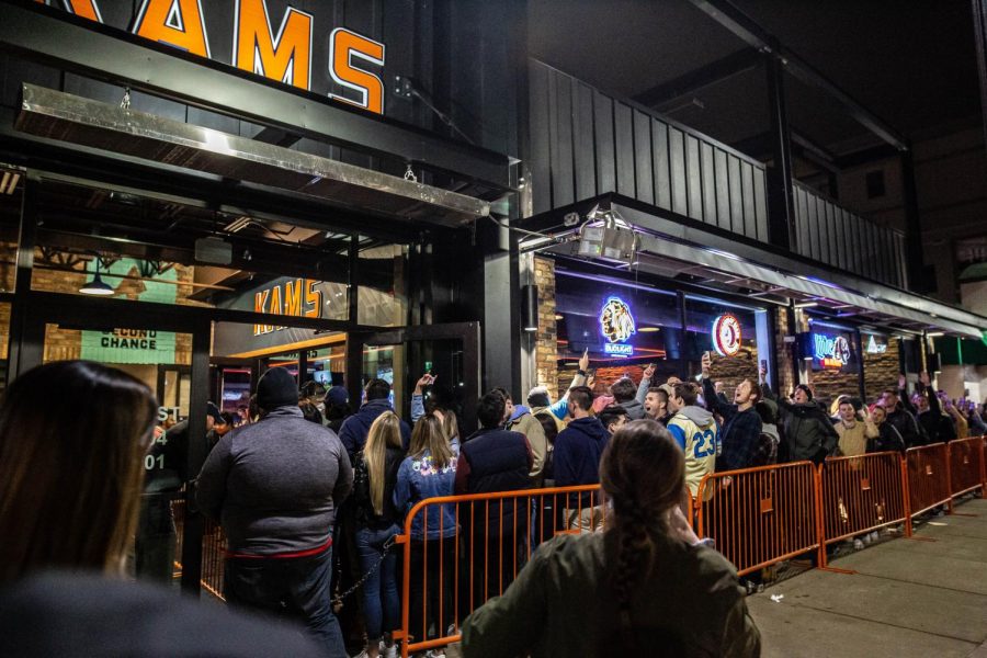 Patrons of KAMs begin to enter the bar on its opening night. 