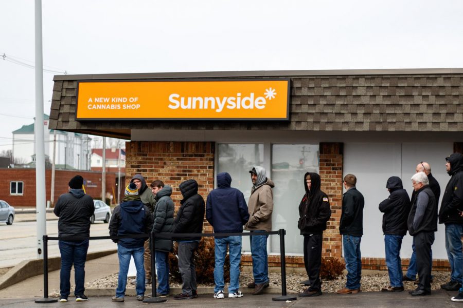 People wait in line at Sunnyside Dispensary on Jan. 22, a cannabis dispensary located on 1704 S. Neil St. Following the legalization of recreational marijuana in the state of Illinois, the C-U community has taken a variety of stances on the topic.