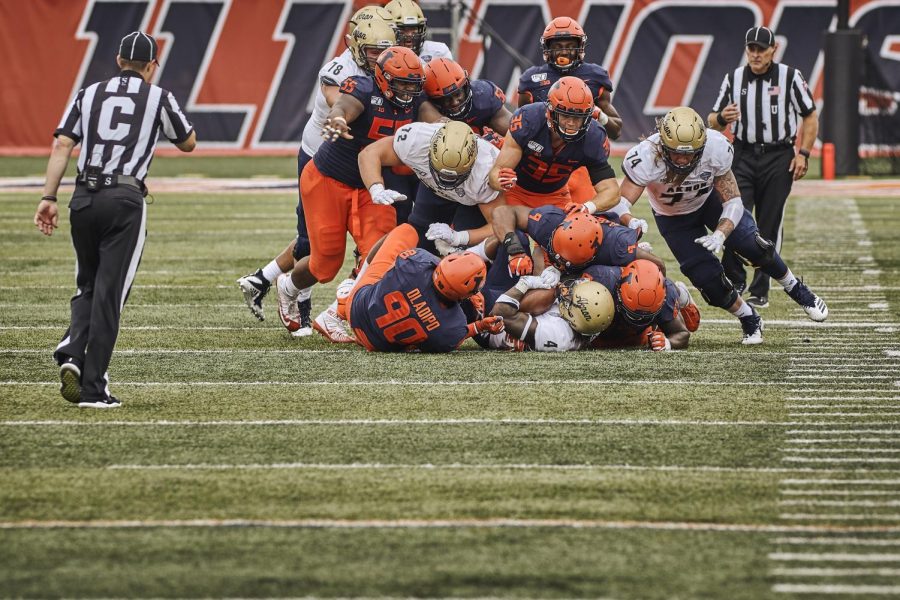 Lere Oladipo (90) makes a tackle in the Illini’s 42-3 victory over Akron on Aug. 31. Oladipo was later suspended and dismissed from the team for violating team rules.
