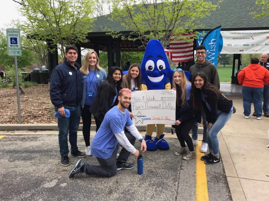 Students in Wishmakers on Campus pose with the Make-A-Wish mascot at a charity event, one of many that the RSO volunteers at each semester. The RSO grants wishes for children with life-threatening illnesses, raising money through several events each year.
