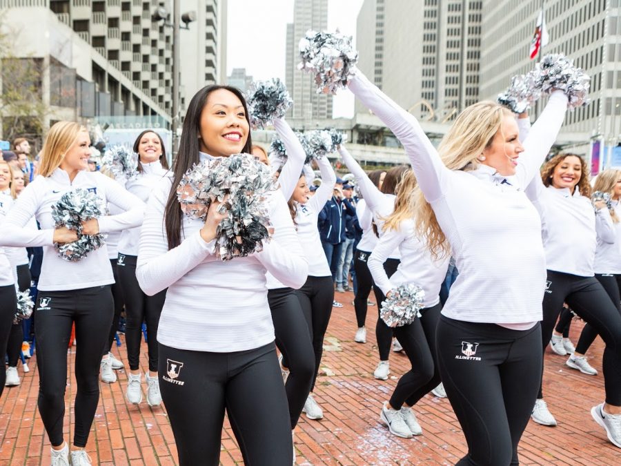 The Illinettes walk through Laney College in Oakland, California, preceding the Redbox Bowl on Dec. 29. To earn a spot on the team, the dancers go through an intense audition process, which involves a prepared solo and a learned routine taught by the captains.