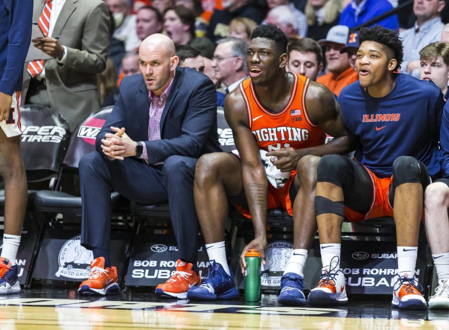 Illinois+mens+basketball+strength+and+condition+coach+Adam+Fletcher+and+freshmen+centers+Kofi+Cockburn+and+Jermaine+Hamlin+watch+from+the+bench+during+Illinois+game+at+Purdue+in+West+Lafayette%2C+Ind.+The+Illini+won+79-62%2C+coining+their+first+victory+at+Mackey+Arena+since+2008.+Photo+taken+by+Jonathan+Bonaguro.+