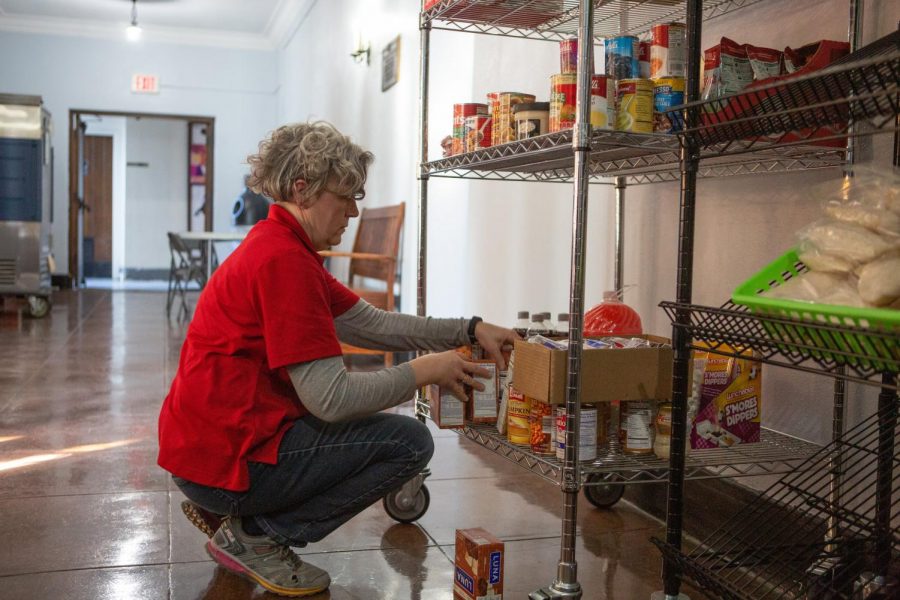 Food Pantry Director Dawn Longfellow organizes items at the Student Food Pantry on Friday.