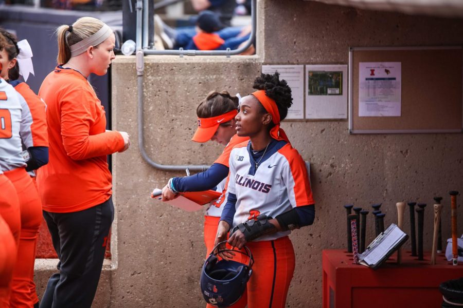 Sophomore outfielder Zaria Dunlap speaks with a team member on April 3. The team will travel down to Waco, Texas, for the Baylor Invitational Friday. 
