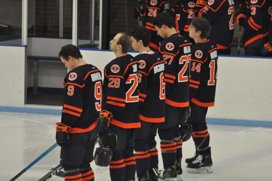 The Illini hockey team listens to the National Anthem before a game against Ohio University Dec. 6. The Illini anticipate an intense matchups against Davenport this weekend since the playoffs are right around the corner. 