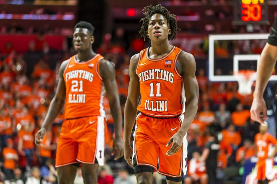 Sophomore+Illini+guard+Ayo+Dosunmu+%2811%29+and+center+Kofi+Cockburn+%2821%29+walk+out+of+a+timeout+after+a+strong+start+by+Michigan+State+during+the+first+half+at+State+Farm+Center+in+Champaign+on+Feb.+11.+Illinois+will+host+Nebraska+Monday+night+at+home.+Tipoff+is+at+7+p.m.+