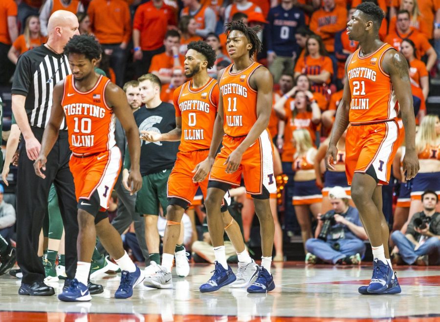 Illini+sophomore+guard+Ayo+Dosunmu+%2811%29%2C+freshman+center+Kofi+Cockburn+%2821%29%2C+sophomore+guard+Alan+Griffin+%280%29%2C+and+senior+guard+Andres+Feliz+%2810%29+head+to+the+bench+for+a+timeout+during+the+second+half+at+State+Farm+Center+on+Feb.+11.+Illinois+travels+to+New+Jersey+Saturday+to+face+Rutgers.+
