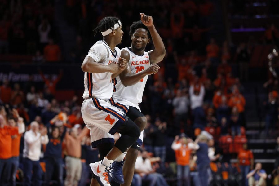 Senior guard Andrés Feliz celebrates with junior guard Trent Frazier after Frazier hurled and sunk a shot from over the half court line heading into halftime during Illinois game against Nebraska at State Farm Center Monday night. Illinois stomped Nebraska 71-59 and improves to 18-9 and 10-6 on the season. 