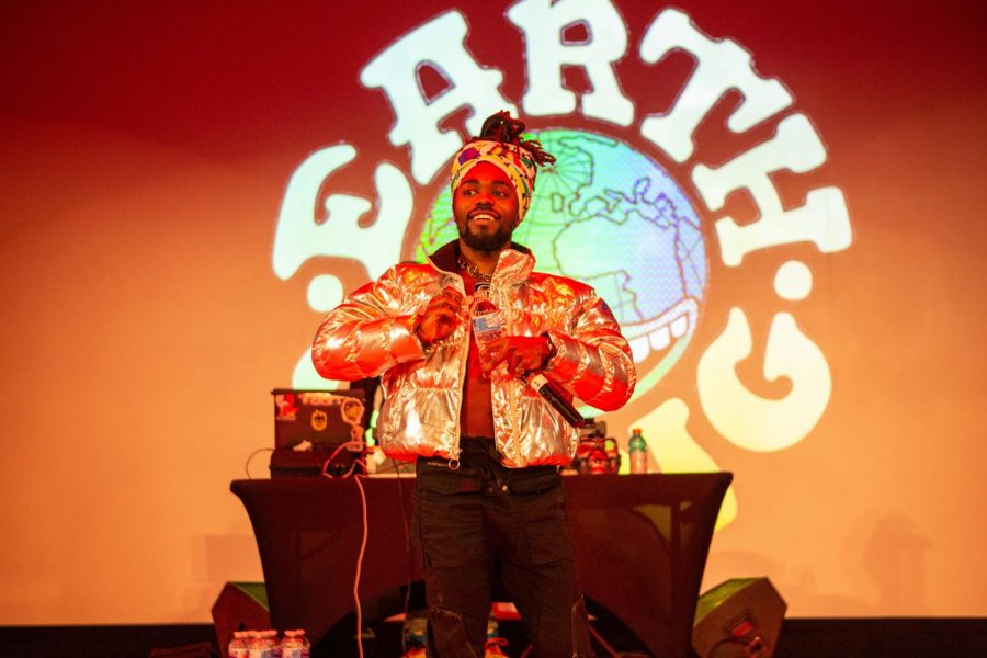 EarthGang member Olu opens a water bottle on the Foellinger stage on Wednesday. EarthGang brought high energy to the small and intimate venue.