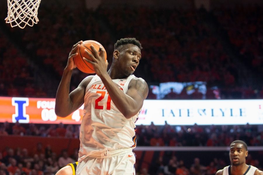 Freshman Center Kofi Cockburn secures a a rebound during the match against Iowa on  Sunday at State Farm Center