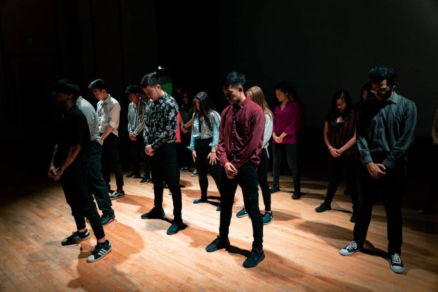 Student models in the 2019 AAA Fashion Show perform a dance routine, showcasing their clothing.