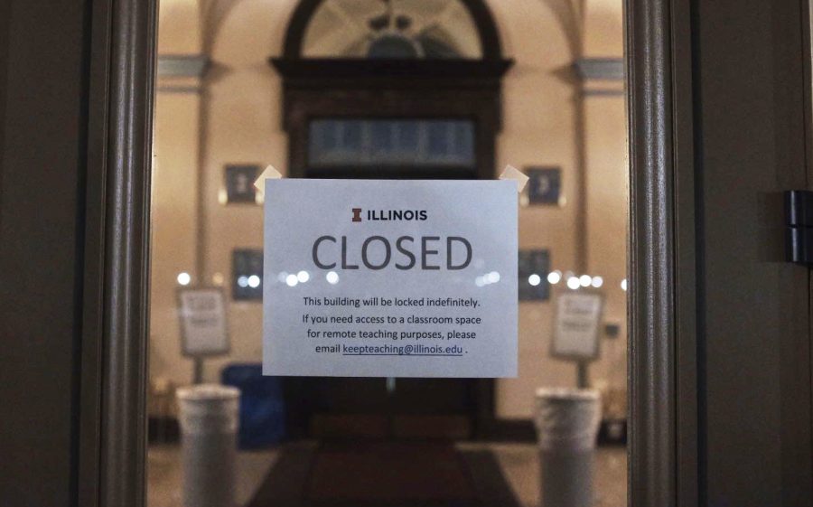 A sign sits on the front door of Foellinger Auditorium
announcing its closure on Friday evening.
