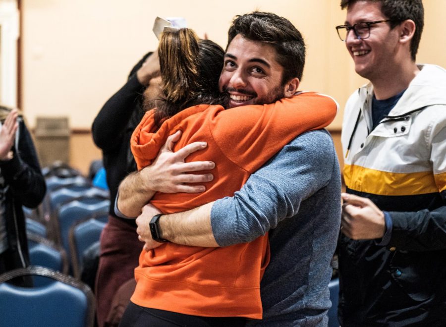 Alexis Perezchica (left) and Chris Ackerman-Avila embrace each other after winning the Illinois Student Government president and vice president vote at the Illini Ball room on Monday evening.