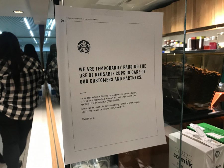 Starbucks has stopped filling customers personal cups, mugs, etc., in wake of concerns over transmission of the new coronavirus. Photo of a sign on the outside door of Starbucks in the Aon building in Chicago taken March 5, 2020. 