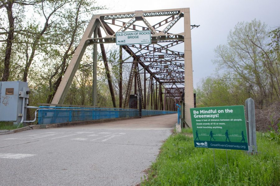 A sign at the entrance of Old Chain of Rocks Bridge near Granite City, IL advises trail walkers to keep six feet of distance between them on April 9.