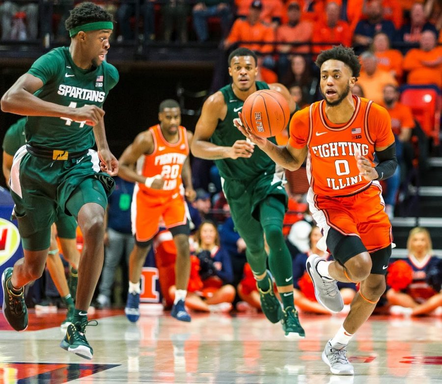 Sophomore Guard Alan Griffin  drives up the court past Michigan State Spartans forward Gabe Brown  during the first half at State Farm Center on  Feb. 11, 2020.