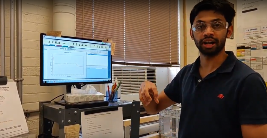 Graduate student Karthik Pattaje  explains the results of a lab he ran for a lecture video he and other TA’s are responsible for filming for online undergraduate classes.