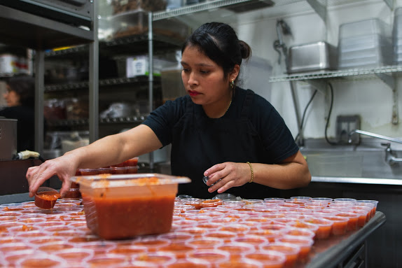 Workers at Maize Mexican Grill, 60 E. Green St., prepping for the lunch rush on Feb. 9, 2020