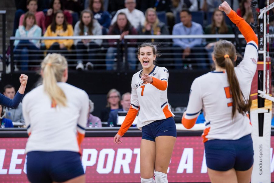 Illinois outside hitter Jacqueline Quade (7) points to setter Jordyn Poulter (1) after scoring a kill during the match against Nebraska in the Final Four of the NCAA tournament at the Target Center on Thursday, Dec. 13, 2018. Nebraska defeated Illinois 3-2.