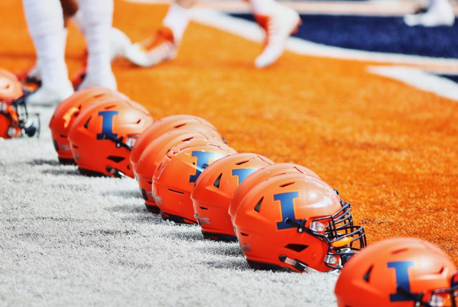 Illinois football helmets line up at the end zone at Memorial Stadium during football spring training on April 13, 2019. 