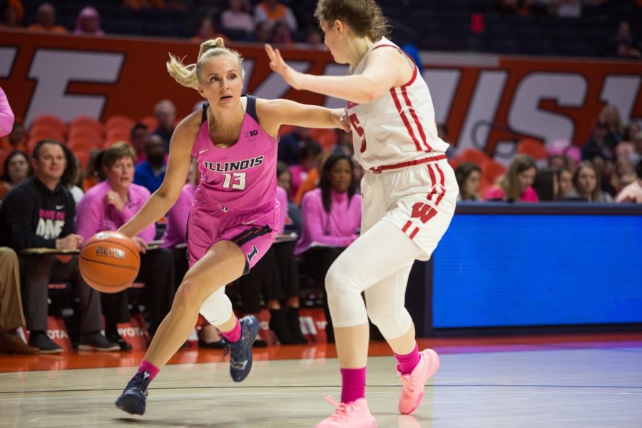 Guard Petra Holešínská pushes forward against a defender during the game against Wisconsin on Sunday. The Illini lost the match 73-64.