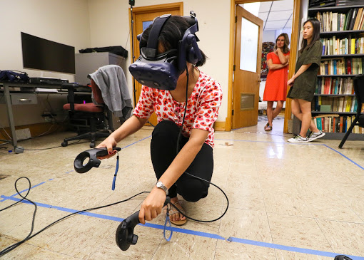 Graduate student Xuehui (Alice) Chao works the virtual reality system for ANTH 399, currently in development, in Davenport Hall on Sep. 19, 2018.