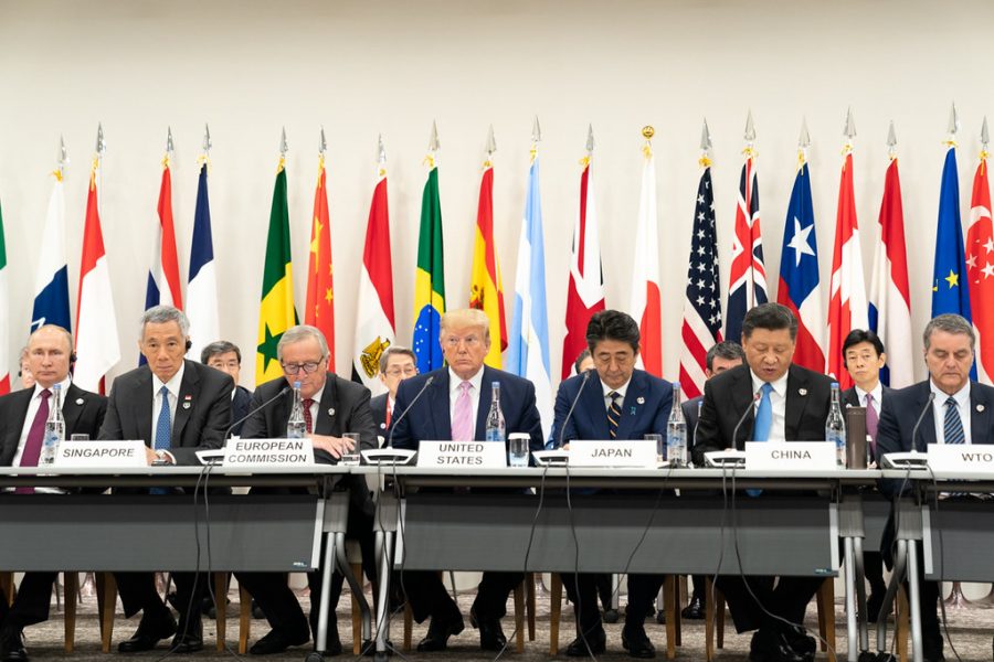 President Donald J. Trump, seated next to Japanese Prime Minister Shinzo Abe, listens as China’s President Xi Jinping, right, delivers remarks at the G20 Leaders Special Event on the Digital Economy at the G20 Japan Summit Friday, June 28, 2019, in Osaka, Japan.