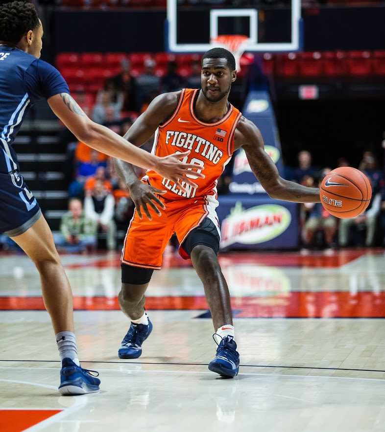 Junior Guard DaMonte Williams passes the ball during the match against Old Dominion on Dec. 14, 2019.