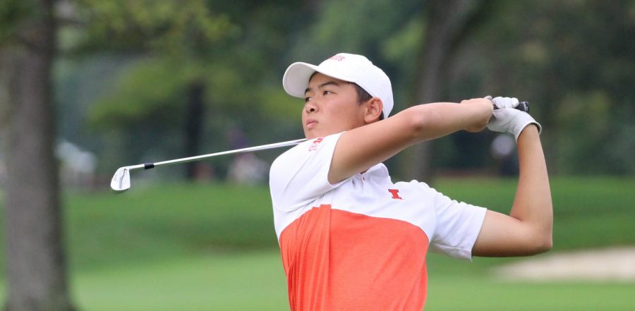 Freshman Jerry Ji watches the arc of his ball after taking a swing during competition.