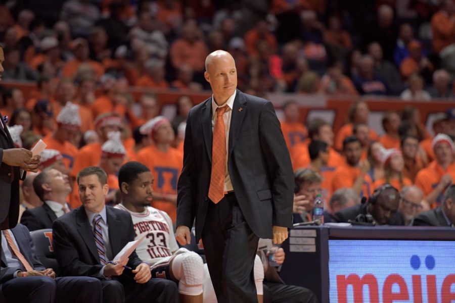 Former Illinois Head Basketball Coach John Groce looks toward the court during the match against NC State on Nov. 29, 2016.