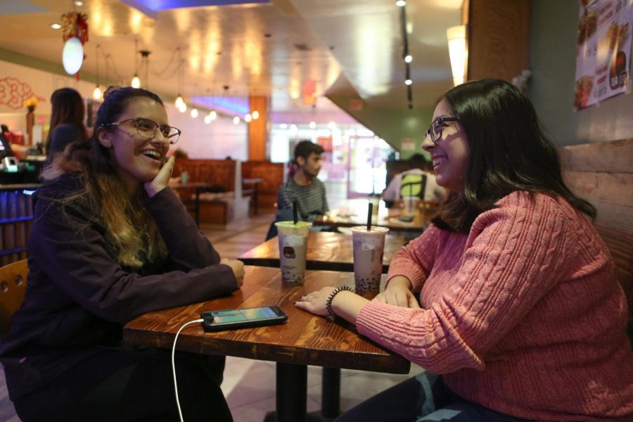 Two Illinois students enjoy time with each other at Kung Fu Tea in Champaign on Oct. 18. 2019.