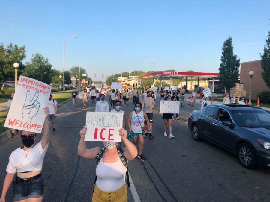 Demonstrators march on University Avenue during a protest against ICE on Friday.