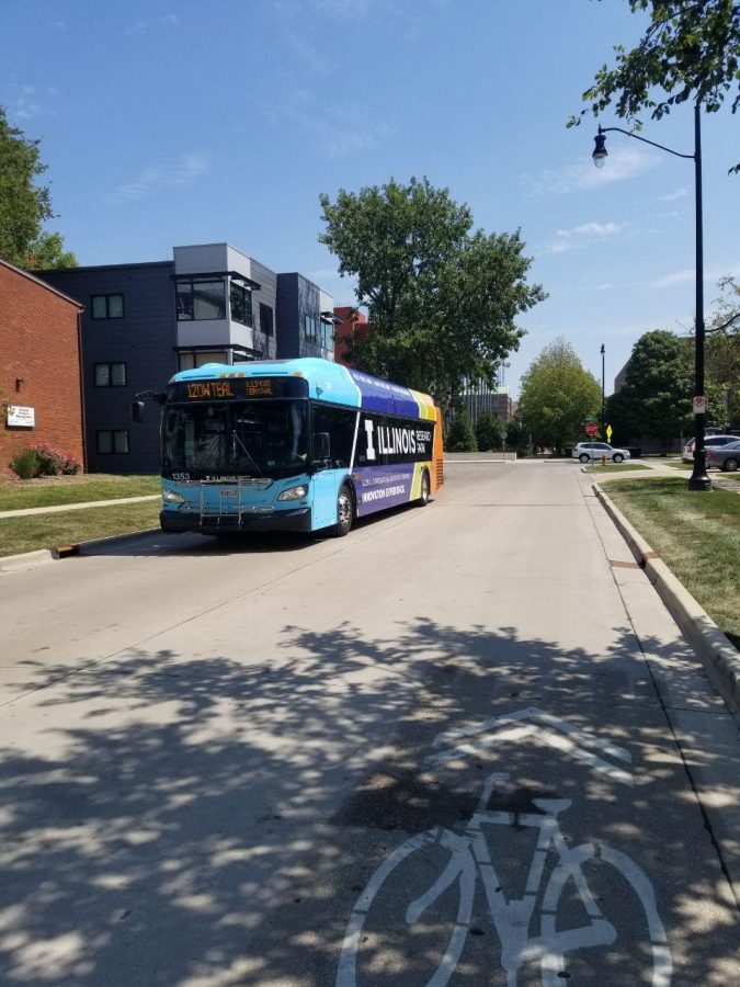 A Champaign-Urbana Mass Transit District bus traveling the 120W Teal route makes its way down White Street on Sunday. While traveling northbound on Fifth Street in Champaign, an MTD bus was caught in gunfire on Sunday.