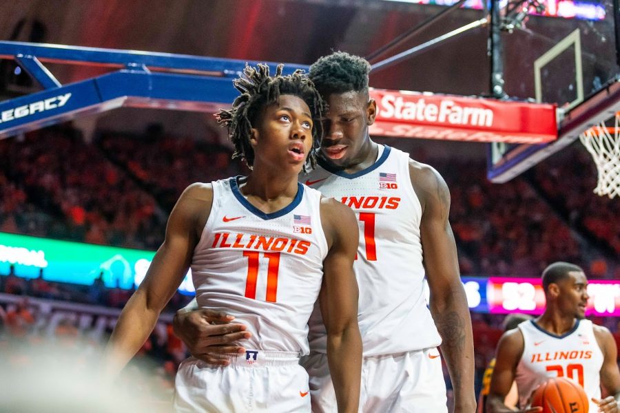 Sophomore guard Ayo Dosunmu and freshman center Kofi Cockburn walk out of a timeout against Michigan State during the first half at State Farm Center in Champaign, Illinois on Feb. 11. Dosunmu and Cockburn recently announced their return to Illinois for the 2020-2021 season. 