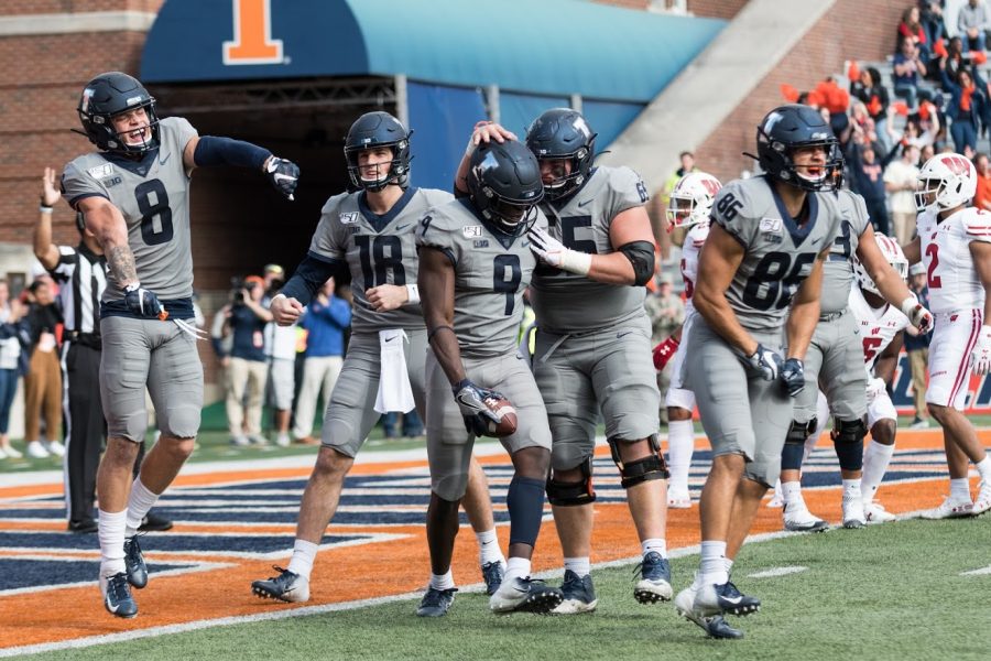 Illinois wide receiver Josh Imatorbhebhe and teammates celebrate a touchdown during the game against Wisconsin on Oct. 19. Big Ten commissioner and the Big Ten Council of Presidents and Chancellors made the decision to postpone the 2020 fall sports season on August 11.