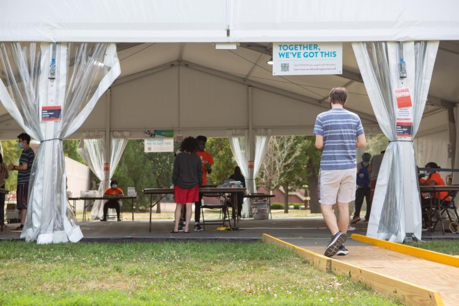 A student enters the COVID-19 testing tent located outside the National Center for Supercomputing on Sunday. This site will be one of the eight open on Labor Day.